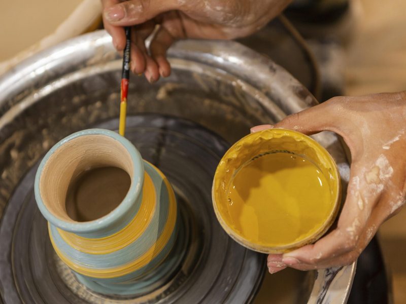 close-up-hands-with-yellow-paint